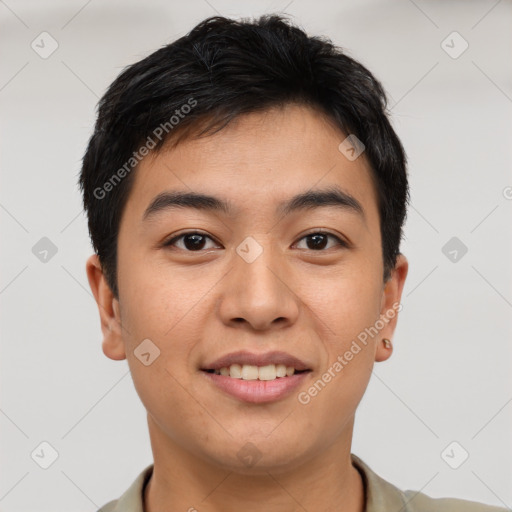 Joyful asian young-adult male with short  brown hair and brown eyes