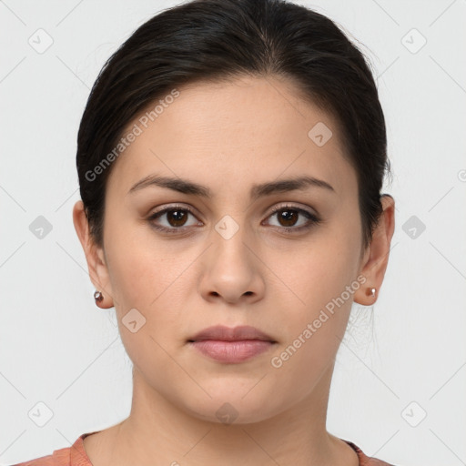 Neutral white young-adult female with short  brown hair and brown eyes