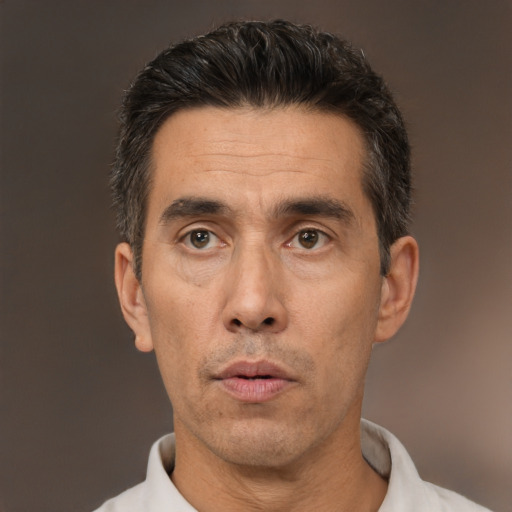 Neutral white adult male with short  black hair and brown eyes