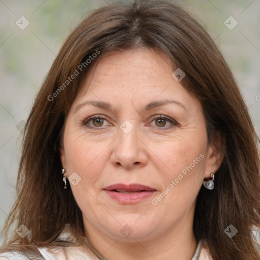 Joyful white adult female with medium  brown hair and brown eyes