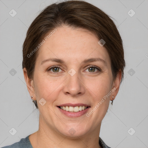 Joyful white adult female with short  brown hair and grey eyes