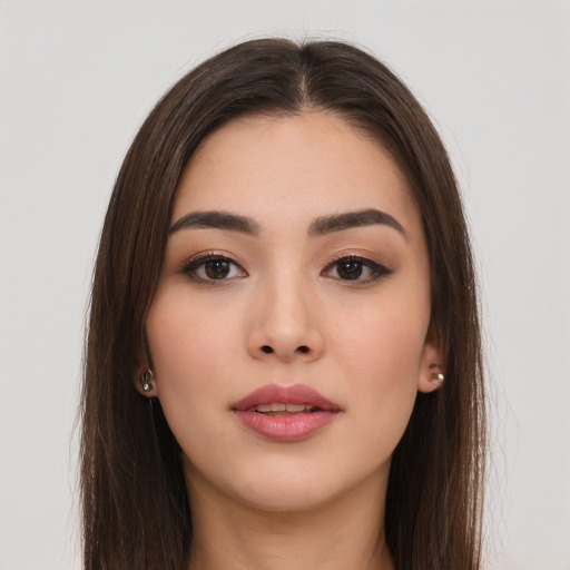Neutral white young-adult female with long  brown hair and brown eyes