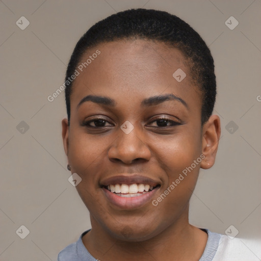 Joyful black young-adult female with short  black hair and brown eyes