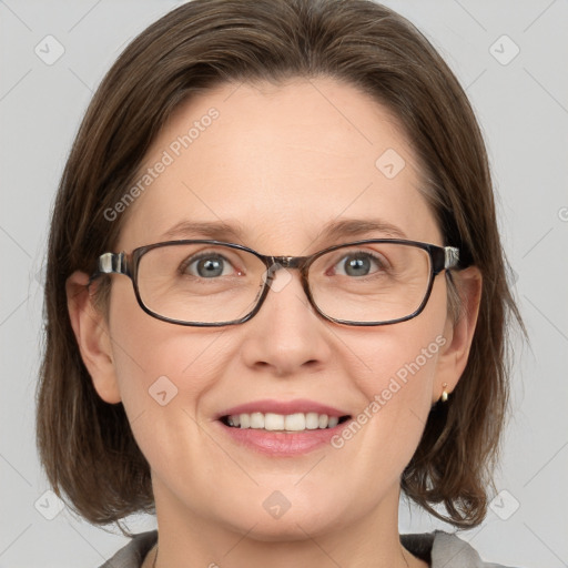 Joyful white adult female with medium  brown hair and blue eyes