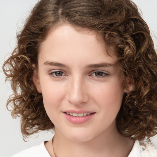 Joyful white child female with medium  brown hair and brown eyes