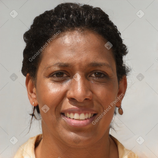 Joyful black adult female with short  brown hair and brown eyes