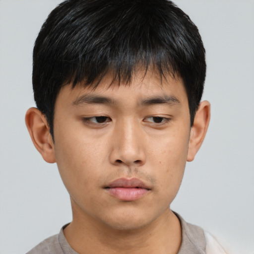 Neutral asian young-adult male with short  brown hair and brown eyes
