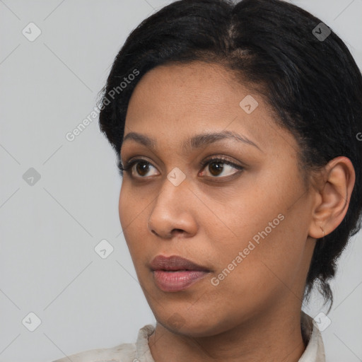 Neutral black young-adult female with short  black hair and brown eyes