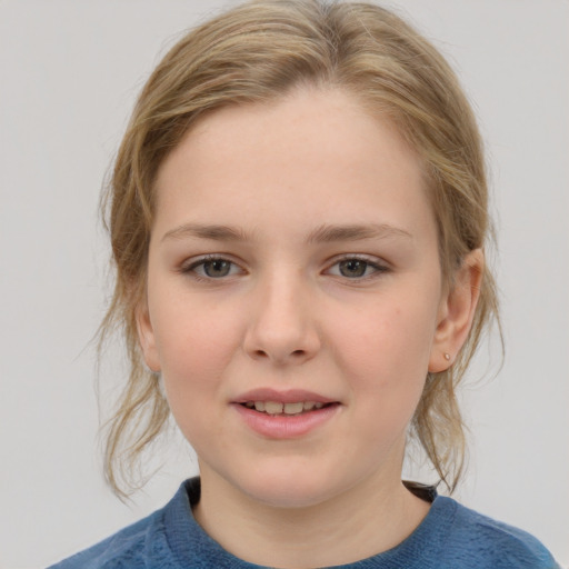 Joyful white child female with medium  brown hair and grey eyes