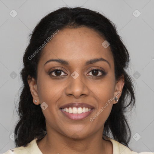 Joyful black young-adult female with medium  brown hair and brown eyes