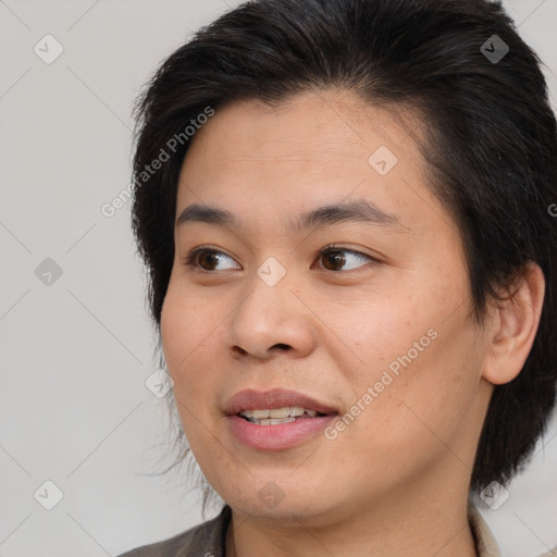 Joyful white young-adult female with medium  brown hair and brown eyes