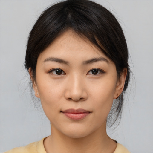 Neutral asian young-adult female with medium  brown hair and brown eyes