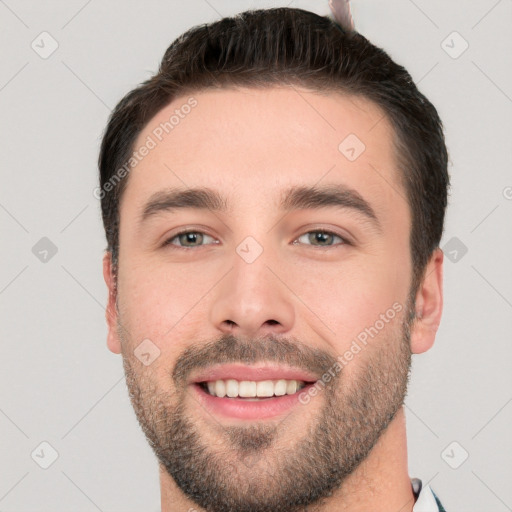 Joyful white young-adult male with short  brown hair and brown eyes