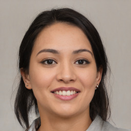 Joyful asian young-adult female with medium  brown hair and brown eyes