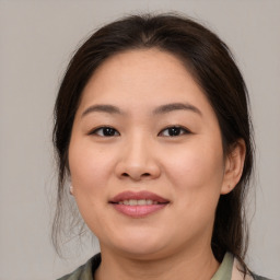 Joyful white young-adult female with medium  brown hair and brown eyes