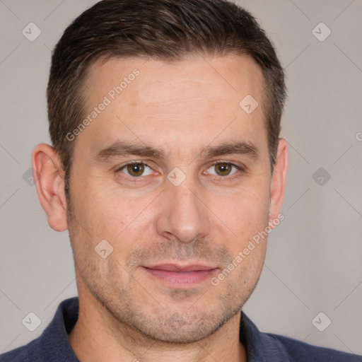 Joyful white adult male with short  brown hair and brown eyes