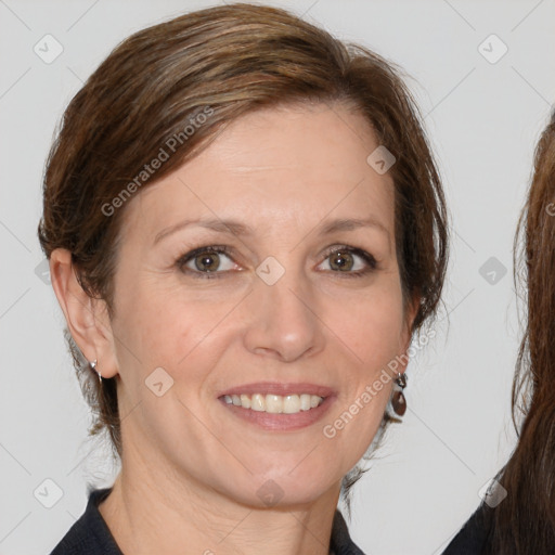 Joyful white adult female with medium  brown hair and grey eyes