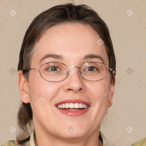 Joyful white adult female with medium  brown hair and grey eyes