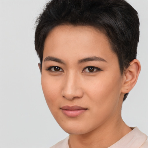 Joyful asian young-adult female with short  black hair and brown eyes