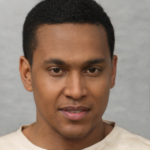 Joyful latino young-adult male with short  brown hair and brown eyes