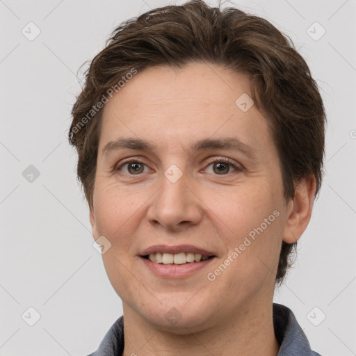 Joyful white adult female with short  brown hair and grey eyes