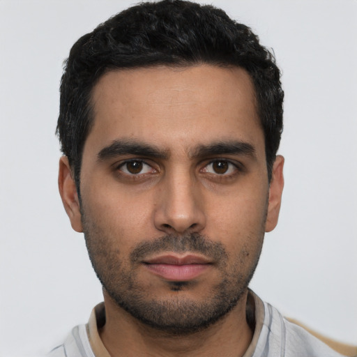 Neutral latino young-adult male with short  black hair and brown eyes