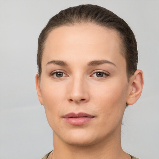 Neutral white young-adult female with short  brown hair and brown eyes