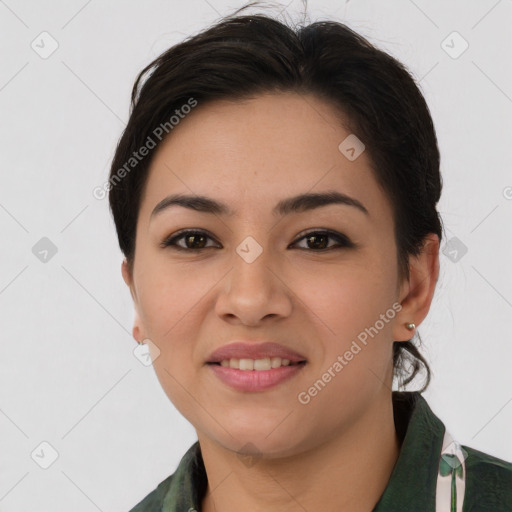 Joyful latino young-adult female with medium  brown hair and brown eyes