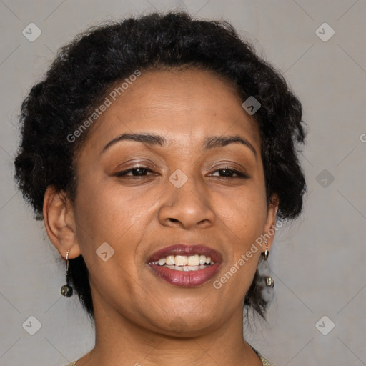 Joyful black adult female with medium  brown hair and brown eyes