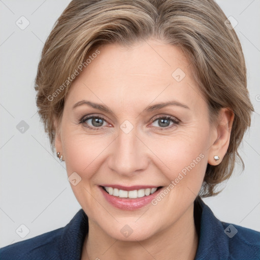 Joyful white adult female with medium  brown hair and grey eyes