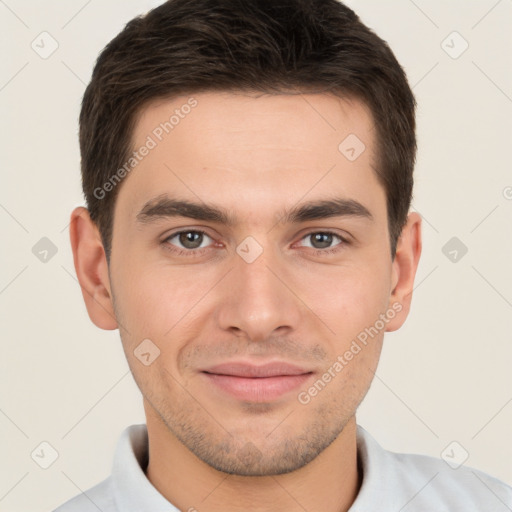 Joyful white young-adult male with short  brown hair and brown eyes