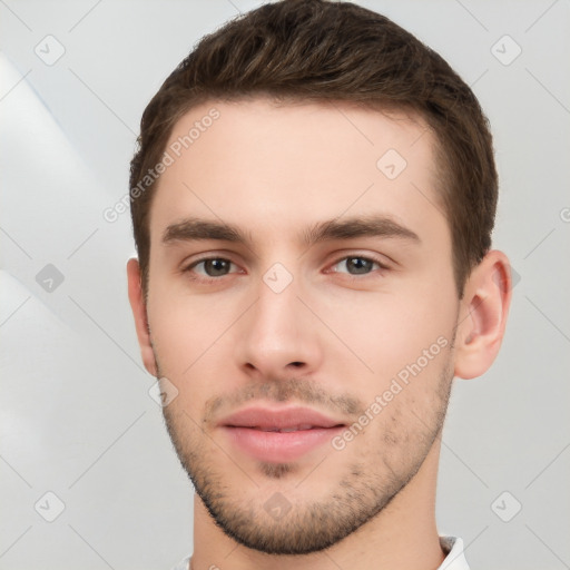 Neutral white young-adult male with short  brown hair and brown eyes