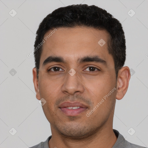 Neutral latino young-adult male with short  black hair and brown eyes