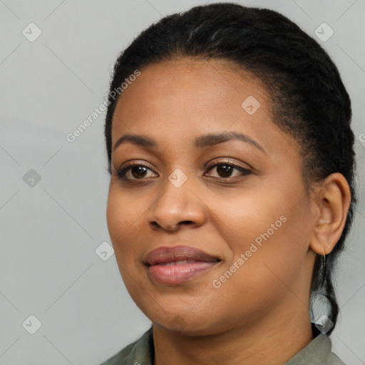 Joyful black young-adult female with medium  black hair and brown eyes