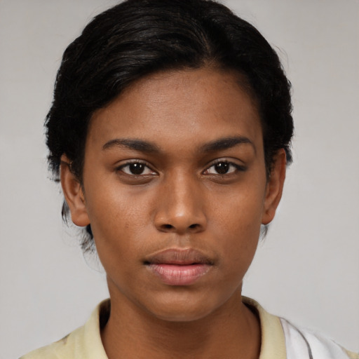 Neutral black young-adult female with short  black hair and brown eyes