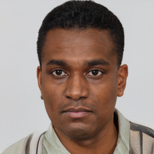 Neutral black young-adult male with short  black hair and brown eyes