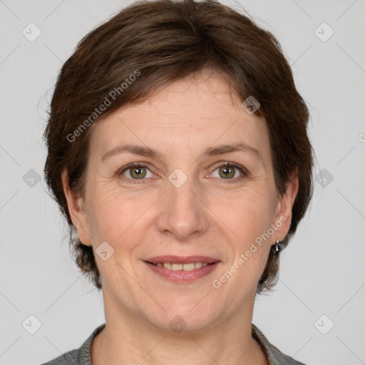 Joyful white adult female with short  brown hair and grey eyes