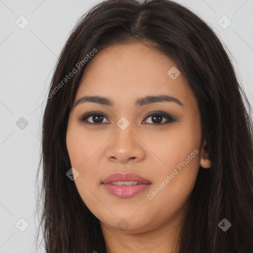 Joyful latino young-adult female with long  brown hair and brown eyes