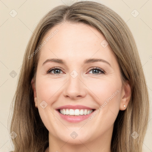 Joyful white young-adult female with long  brown hair and green eyes