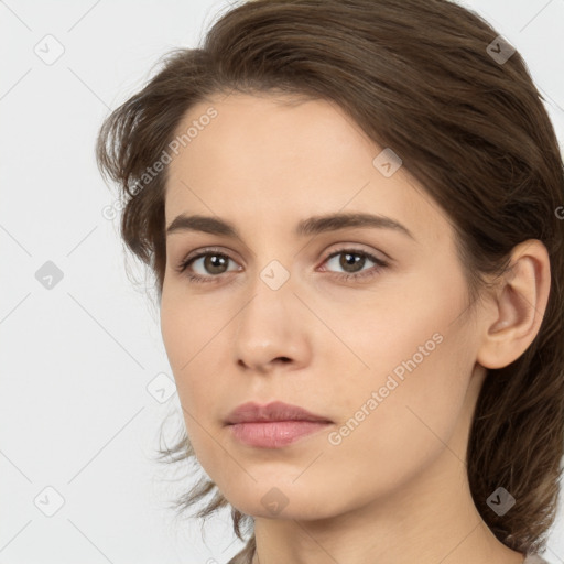 Neutral white young-adult female with medium  brown hair and brown eyes