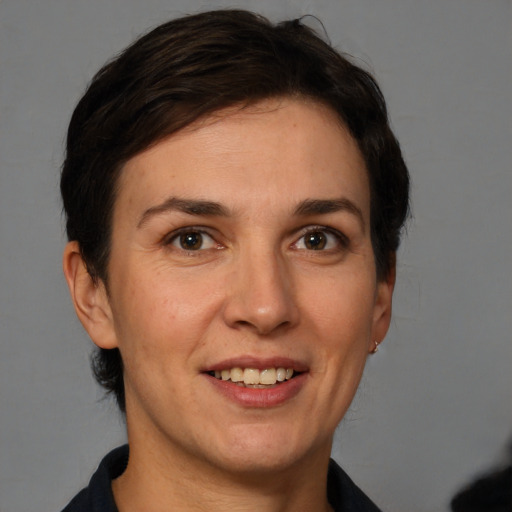 Joyful white adult female with short  brown hair and brown eyes