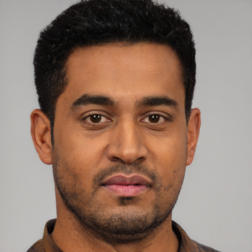 Neutral latino young-adult male with short  black hair and brown eyes