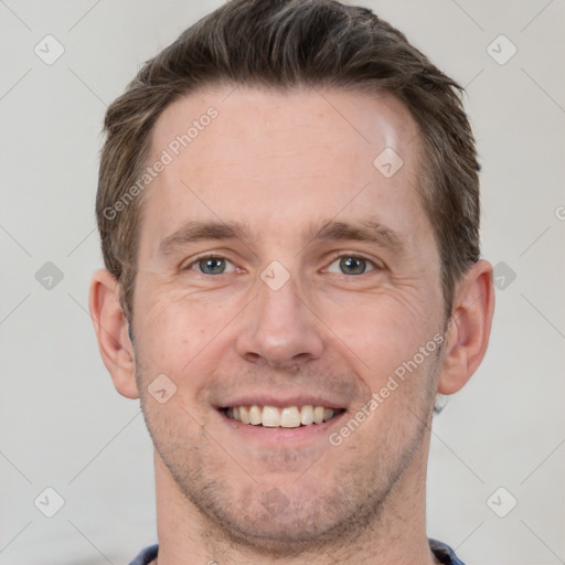 Joyful white adult male with short  brown hair and grey eyes