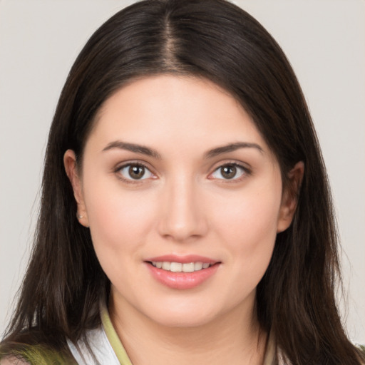 Joyful white young-adult female with medium  brown hair and brown eyes