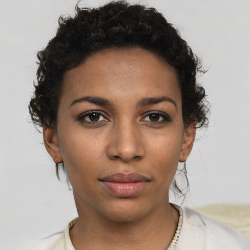 Neutral black young-adult female with short  brown hair and brown eyes