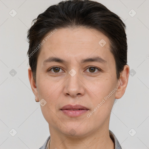 Joyful white adult female with short  brown hair and brown eyes