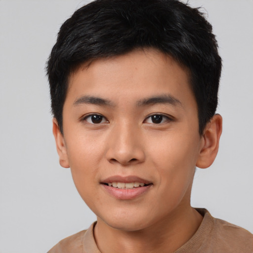 Joyful asian young-adult male with short  black hair and brown eyes