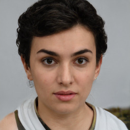 Neutral white young-adult female with short  brown hair and brown eyes