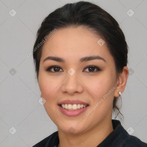 Joyful asian young-adult female with medium  black hair and brown eyes