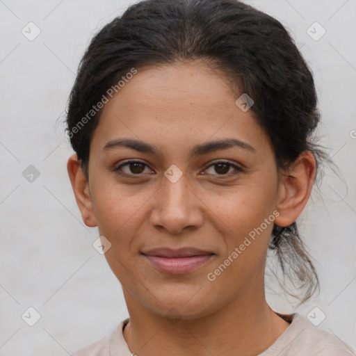 Joyful latino young-adult female with short  brown hair and brown eyes